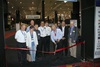 HMA president Fred Hill (with scissors) cuts the ribbon to open the 2012 iHobby Expo, the first ever in Cleveland.